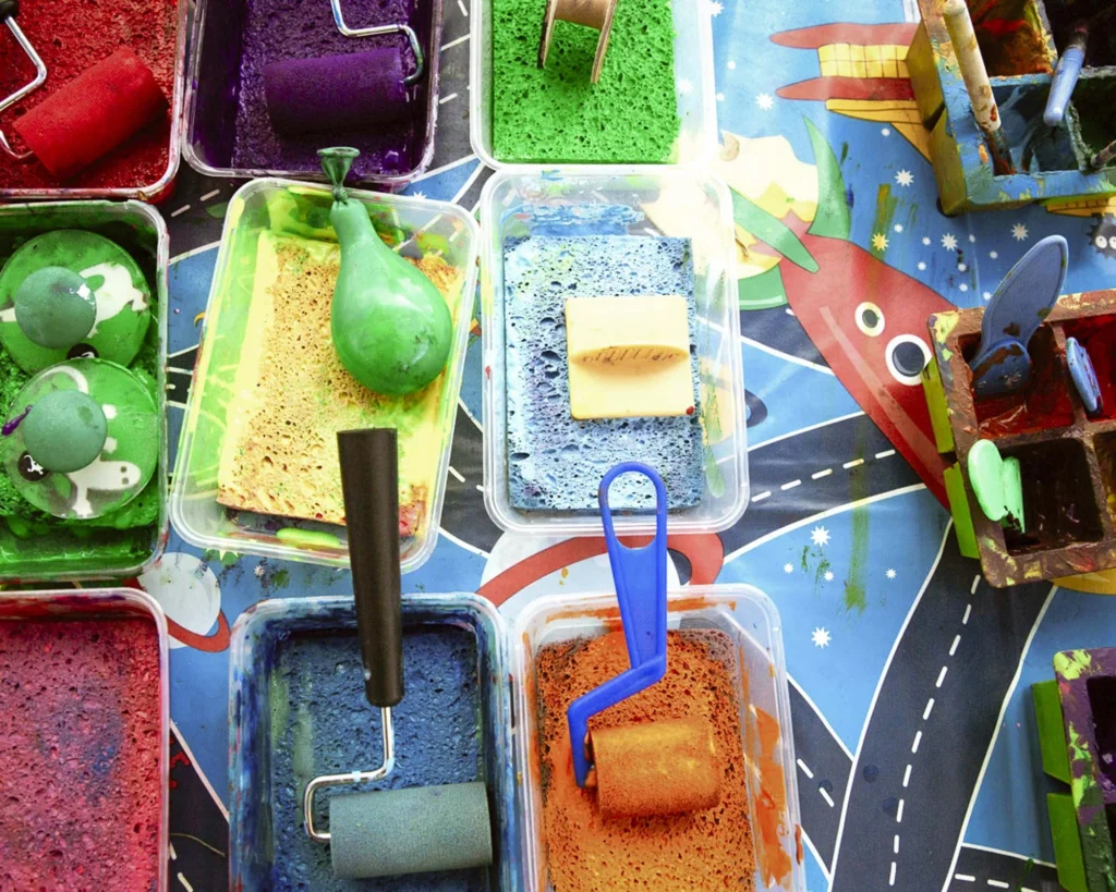 Arts and crafts supplies on the arts and craft table at a children's event.