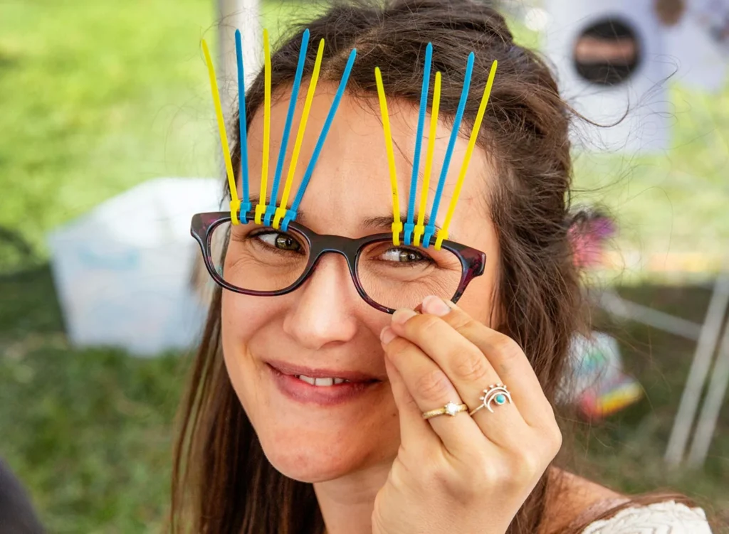 Kidzklub staff member creating at our imagination station kids art zone.