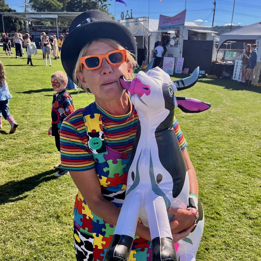 Kidzklub entertainer Shorty Brown with blow up cow at Groovin the Moo in Lismore